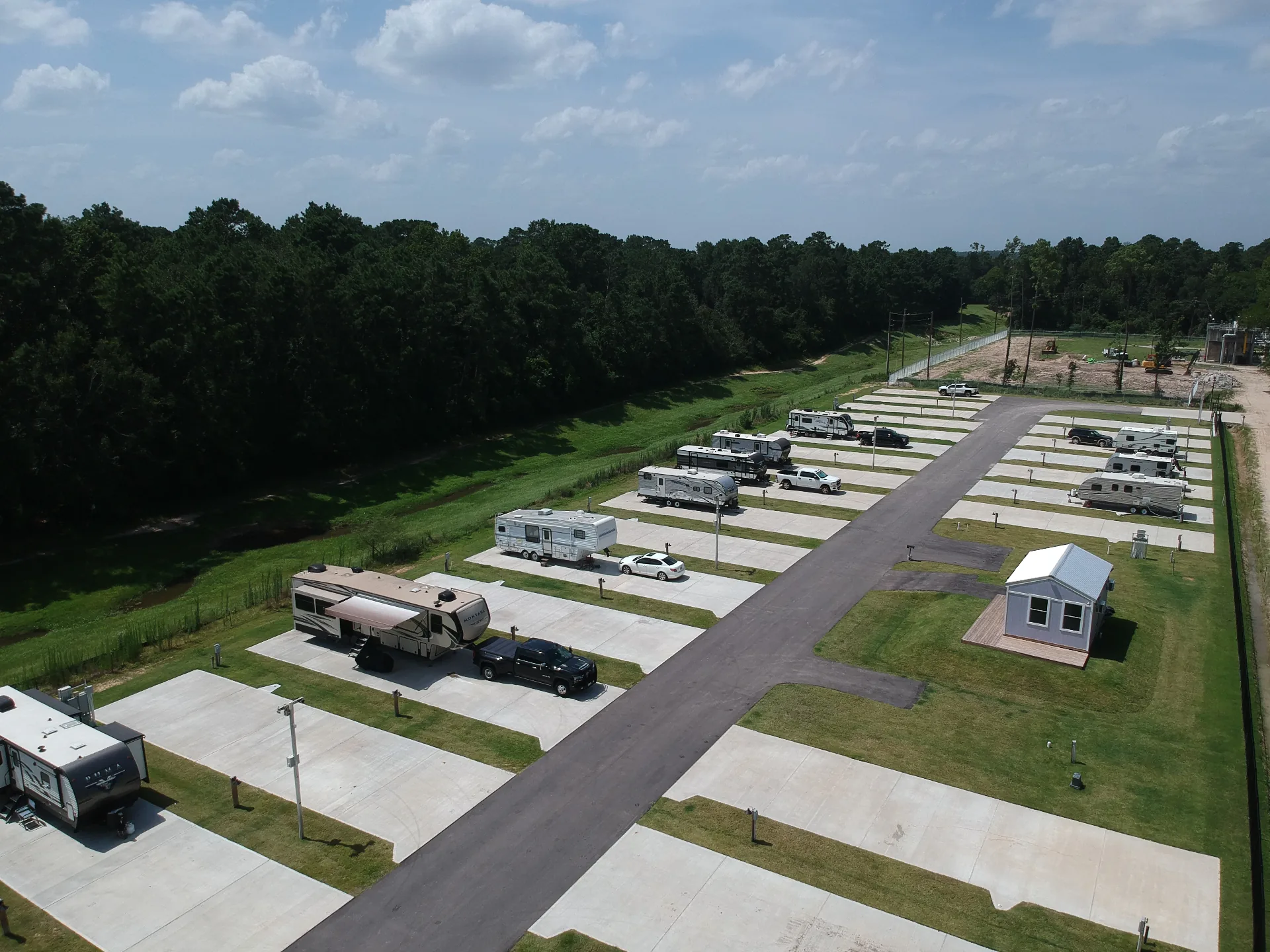 Aerial view of concrete pads and occupied RV sites