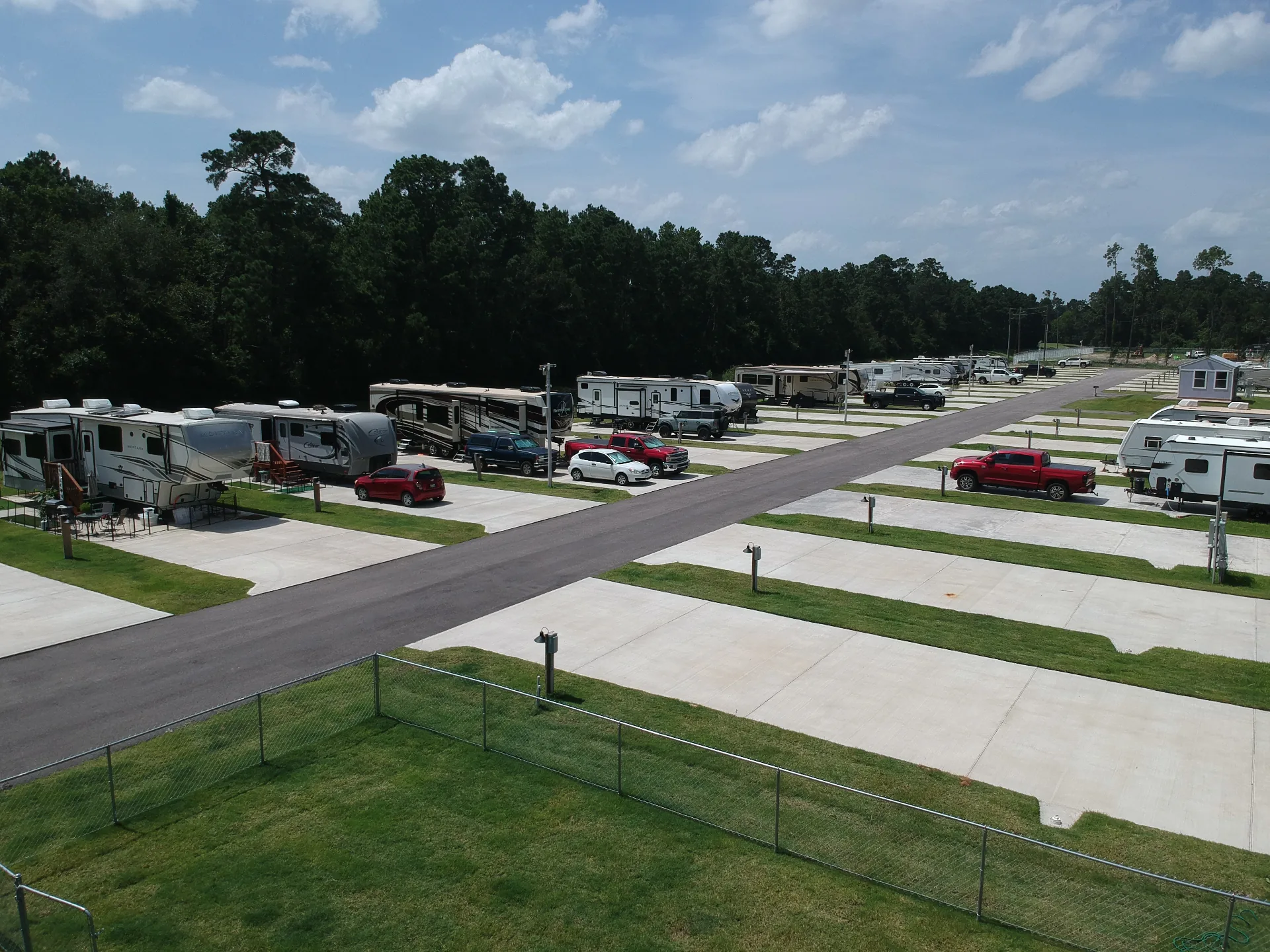 Aerial view of occupied RV sites along the main drive at Gleneagles RV Resort
