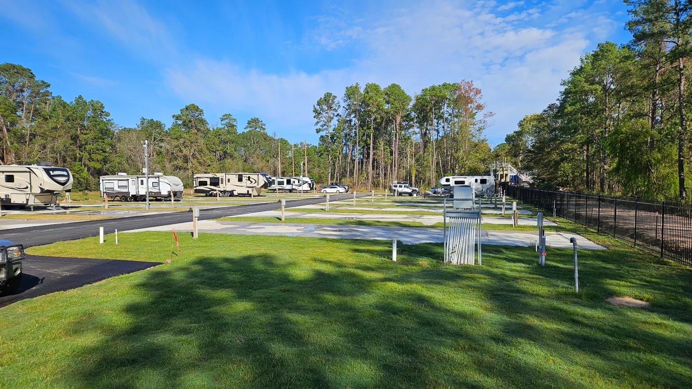 Full hookup RV site with concrete pad at Gleneagles RV Resort Conroe TX